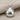 Domed ladybug beetle pendant, polished silver, front view on fabric