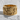 Detailed relief carving on the Jesus Apostles ring displayed on a textured white stone surface in natural light