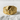 Close-up view of gold vermeil wolf moon ring displaying detailed wolf mane texture on white stone background