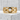 Geometric Cutout Ring, gold vermeil, front view on concrete block