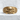 Ribbed Skull Crossbones Ring, gold vermeil, front view on stone pedestal