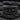 Twisted Rope Last Supper Ring, black rhodium plated, front view on slate stone
