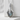 Labradorite Dragon Claw Pendant, polished silver, front view on stone pedestal