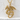 Serpent Dragon Pendant, gold vermeil, product photo against textured wall