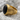 First Division Onyx Signet Ring, gold vermeil, angled side view on rock