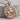 Saint George Medallion Pendant, rose gold, product photo on wood