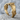 Roosting Bat Ring, gold vermeil, angled side view on rock