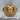Ram Signet Ring, gold vermeil, front view on stone surface