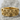 Four Evangelists Ring, gold vermeil, product photo on stone surface