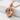 Dragon Claw D20 Pendant, rose gold, product photo on stone pedestal
