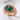 Green Dragon Eye Ring, rose gold, angled product view on white surface