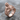 Transi Effigy Ring, rose gold finish, angled view displayed on stone surface