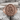 Lovers of Valdaro Signet Ring, rose plated silver, front view on rock