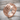 Grasping Hands Ring, rose gold, angled view on stone