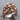 Skull Pile Signet Ring, rose plated silver, front view on stone