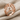 Web Dome Ring in rose gold, angled view on fabric