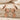 Falling Leaf Earring in rose gold, front pair on travertine stone