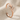 Stag Antler Cuff Earring, rose gold, angled view on fabric