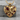 Cracked heart pendant, gold vermeil, product photo on stone