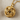 Gordian Knot Pendant, gold vermeil, product photo on linen