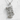 Rescue Combat Medic Pendant, polished silver, front view on textured surface