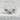 Smiling Frog Ring, polished silver, front view on textured surface