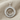 Hittite Sun Standard Pendant, polished, product photo on fabric