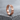 Love Wins Ring, black rhodium, angled view on stone base