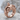 Stone Prisoner Ring, rose gold, product photo on stone surface