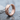 Faceted Rhombus Hoop Earring, rose gold, side view on stone