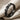 Happy Face Disc Ring, black rhodium, angled view on fabric