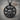 Celtic Mother Goddess Pendant, black rhodium plated, front view on wood