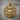 Celtic Mother Goddess Pendant, gold vermeil, front view on wood