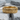 Vertical bark band ring, gold vermeil, resting on stone