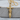 Celtic Dagger Pendant, gold vermeil, front view on wood base