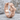 Gothic Cross Hoop Earring, rose gold, product photo on stone