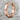 Notched Industrial Hoop Earring, rose gold, angled product photo on stone