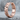 Zigzag Geometric Hoop Earring, rose gold, angled side view on stone