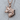 Fox Head Pendant, rose gold, side profile view on wood surface