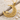 Scroll Crescent Star Pendant, gold vermeil, angled view on sand with driftwood