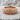 Woven rock ring, rose gold, product photo on stone