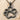Paw Print Pendant, black rhodium, front view on sand