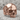 Baroque Flourish Skull Ring, rose gold, product photo on stone