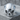 Angry Skull Ring, polished, front view on stone pedestal