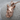 Rhinoceros Head Pendant, rose gold, three-quarter product view on stone
