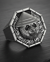 Angled view of silver panda ring wearing conical hat featuring ribbed shank and octagonal bezel