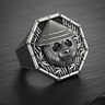 Angled view of silver panda ring wearing conical hat featuring ribbed shank and octagonal bezel