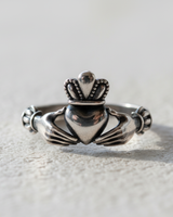 Front view of traditional silver Claddagh ring symbolizing love loyalty and friendship with oxidized finish