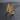 Gold vermeil angel wings ring with pave stones on the edge displayed on black texture