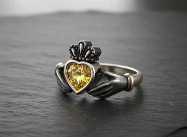 Handcrafted 925 silver Claddagh ring with an oxidized finish, close-up view highlighting the detailed hands and crown design.